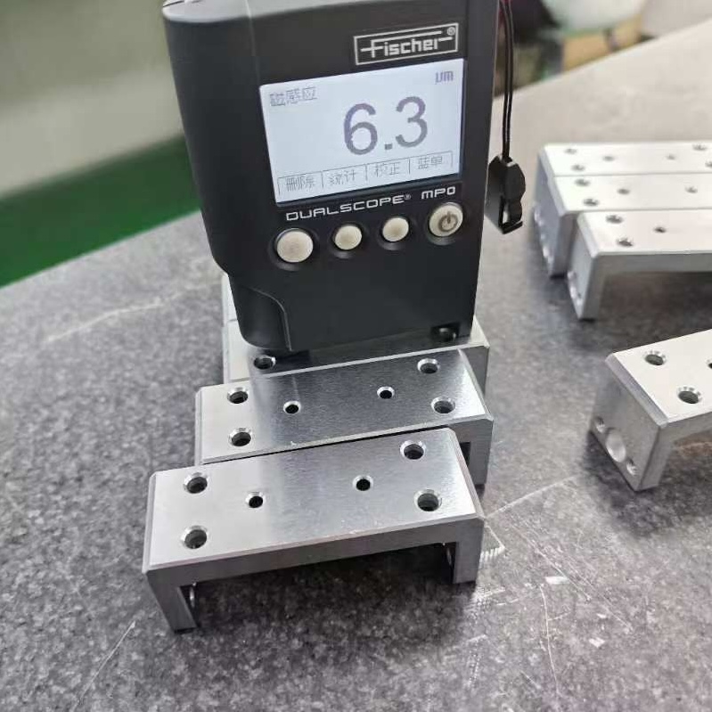 Coating thickness gauge testing on cnc machined aluminum components