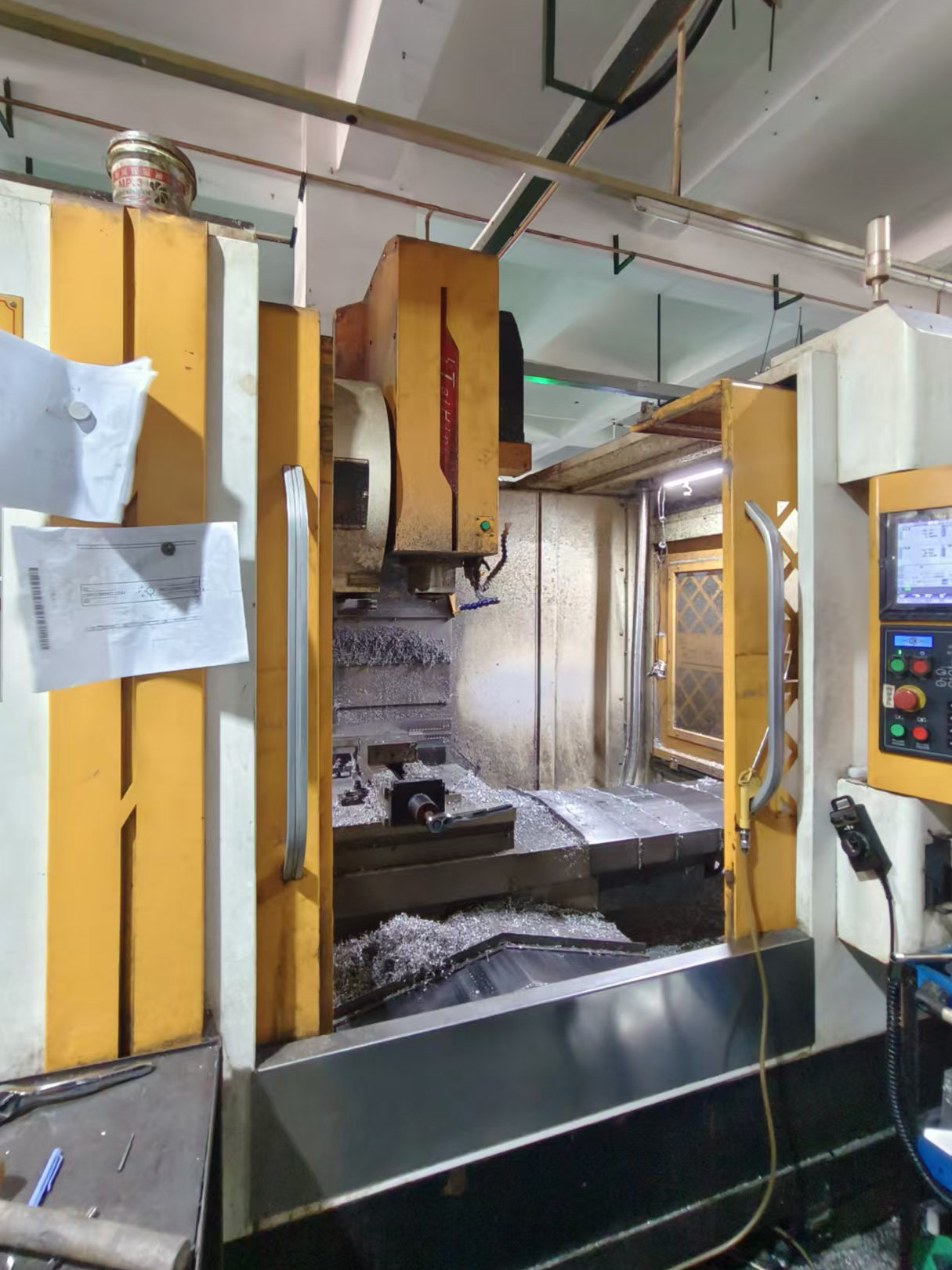 Vertical cnc milling machine processing metal parts in VAY factory